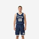 Navy and white reversible basketball uniforms showing navy topographic front and cream-white reverse side, with team name and number on both sides