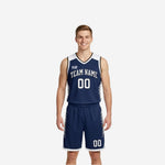 Navy and white reversible basketball uniforms front view showing arced team name and diagonal stripe side panels on the navy side