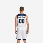 Opposite side view of the custom navy and white reversible basketball uniform highlighting the shorts side panel stripe detail