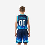Right side view of custom navy youth basketball uniforms showing cyan armhole binding and matching shorts side vent trim
