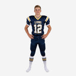 Navy youth football uniforms front view showing gold V-neck trim, team name Lions, front number 12, and white side panels on the jersey