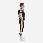 Side view of custom navy youth football uniform showing gold and white double side stripe on the matching navy pant and sleeve number placement