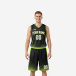 Custom neon green basketball uniforms full set front view showing black jersey with green hex-dot panels and matching shorts on male model