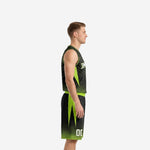 Front view of custom neon green and black sublimated basketball uniform with arched team name and number 00 on male athlete