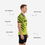 Close-up detail of black contrast trim at sleeve cuff on neon green custom printed practice jersey