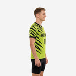 Left side view of neon green custom printed practice jersey showing full tiger claw sublimated print across sleeves