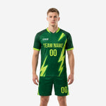 Custom neon green soccer uniforms with forest green body and lightning bolt sublimation print, front view on male model