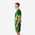 Custom forest green and neon green soccer uniform set side view highlighting lightning bolt print on jersey and shorts