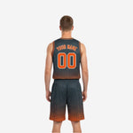 Charcoal and orange reversible basketball uniform opposite side view showing dark halftone jersey and matching shorts