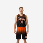 Orange and black reversible basketball uniforms showing black hex side front with orange gradient shorts on adult male model
