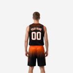 Side view of black and orange sublimated reversible basketball uniform set with hexagon pattern on jersey and shorts