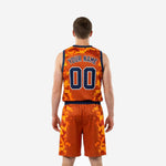 Back view of the orange and blue digital camo basketball uniform showing the player name and number printed in navy with white outline
