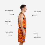 Close detail of the orange digital camo basketball shorts with navy elastic waistband, drawcord, and player number at the hem
