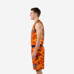 Second side view of the orange and blue camo basketball uniform set showing the shorts number at the lower left hem and navy armhole binding
