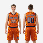 Full-set view of the orange and blue custom basketball uniform showing the jersey and shorts together in matching digital camo sublimation