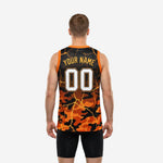 Opposite side view of orange and yellow basketball jersey displaying armhole binding and full-panel orange and black camo sublimation print
