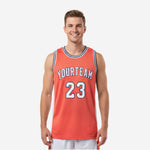 Custom orange basketball jerseys with white side panels, navy crew-neck binding, arced team name, and front number 23 shown front and back