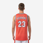 Opposite side view of custom orange and white club basketball jersey displaying side panel seam and straight game-length hem