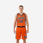 Front and back view of a custom orange basketball uniform set with navy lightning bolt side panels and distressed crackle pattern on jersey and shorts