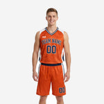 Orange basketball uniform full set showing sublimated marble-texture jersey and matching shorts with navy and white side panels, front view