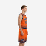 Men's custom orange basketball uniform front view showing arced team name, front number, and navy V-neck trim