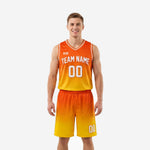Custom orange basketball uniform with orange-to-gold gradient fade, white V-neck binding, arced team name, front number, and matching shorts, front view