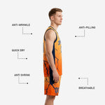 Detail of orange basketball shorts with navy lightning crack sublimation pattern and player number on right leg