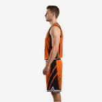 Right side view of orange and black basketball kit highlighting angular side panels and striped hem