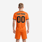 Detail view of orange custom soccer kit collar and sleeve trim