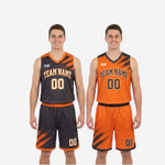 Detail of orange and black reversible jersey V-neck collar with contrast binding and sublimated brush-stroke shoulder panel