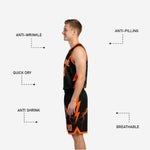 Shorts detail of orange and black reversible basketball uniform showing lightning bolt sublimation and black hem binding