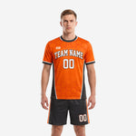 Orange and black custom soccer outfits with honeycomb texture jersey and matching shorts, front view