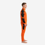 Side view of orange soccer tracksuit with black geometric brush-stroke panels on sleeves and outer thigh