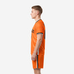 Right side view of orange and black custom soccer uniform set
