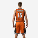 Detail view of custom sublimated bball uniform in Athletic Orange with tonal basketball graphic watermark