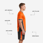 Detail view of black soccer shorts with orange and white side stripe panel from K2 custom kit