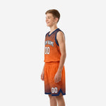 Side view of orange and navy sublimated youth basketball uniform showing V-neck collar binding and matching halftone shorts with drawcord waistband