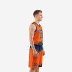 Adult male wearing custom orange and navy basketball uniform set with splash pattern, arced team name and front number, front view