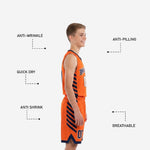 Front and back display of orange youth basketball uniforms with navy V-neck binding, arced team name, and matching shorts number