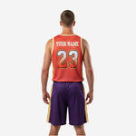 Orange and purple basketball uniform set detail showing gold trim and arched team name