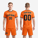 Full set view of orange and black sublimated soccer team uniform kit