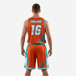 Detail shot of orange teal custom basketball shorts with arrow geometric panel and number placement