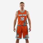 Front view of orange and teal custom basketball uniform with sublimated graphic panels and team name