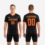 Back view of orange soccer training jersey showing player surname and back number placement in orange print