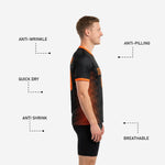 Detail shot of full-dye sublimated orange diagonal stripe panel on black mens soccer training top
