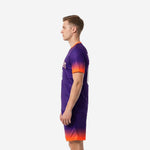 Right side view of custom soccer uniform kits for teams in Royal Purple and Neon Orange with orange V-neck trim band detail