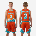 Back view of orange youth basketball uniform set with teal binding on neckline and player name and number placement