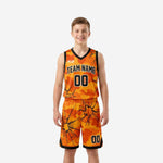 Custom orange youth basketball uniforms in orange and black camo with cracked-glass sublimation, full set front and back view