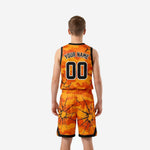 Opposite side view of custom printed youth basketball uniforms showing camo pattern continuity across jersey and shorts