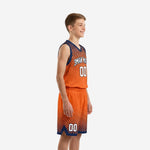 Front view of custom orange and navy halftone youth basketball jersey with arced team name and bold front number 00 on youth boy